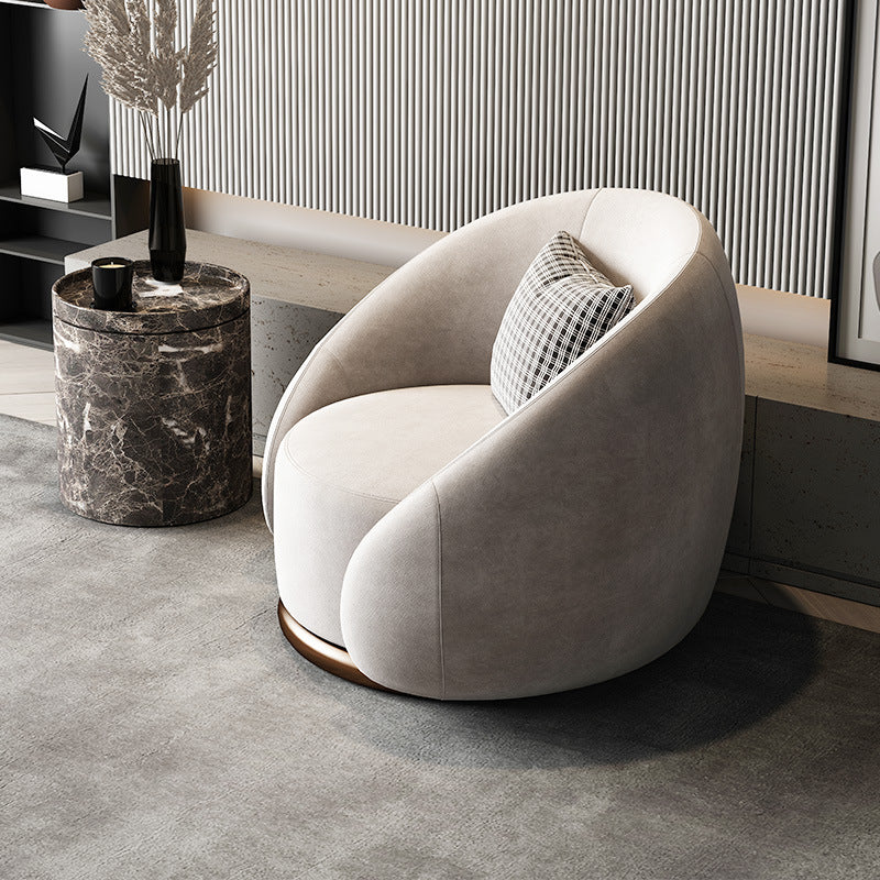 Fauteuil pivotant arrondi en velours, socle doré