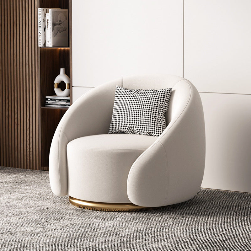 Fauteuil pivotant arrondi en velours, socle doré