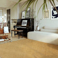 Tapis effet sisal AUBRYNE camel doré dans un salon
