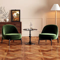 Deux fauteuils en velours vert sapin et guéridon